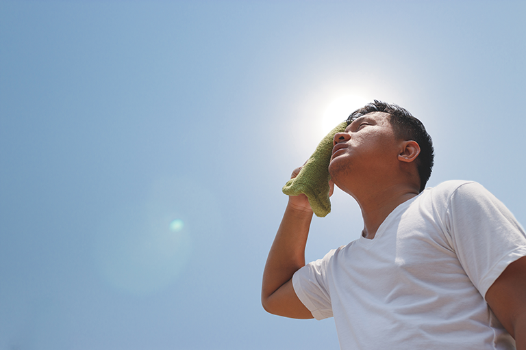 Man in sun overheating