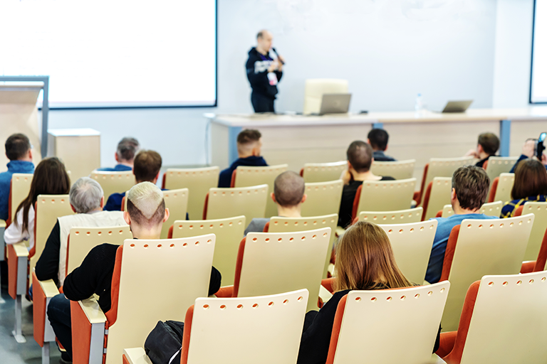 Adults in lecture hall