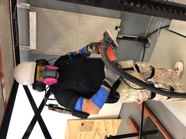 Man in exoskeleton at construction site 