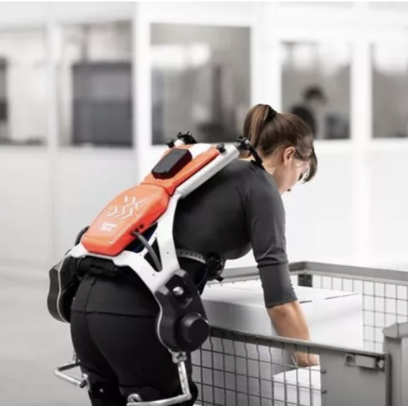 Women picking up an item with exoskeleton
