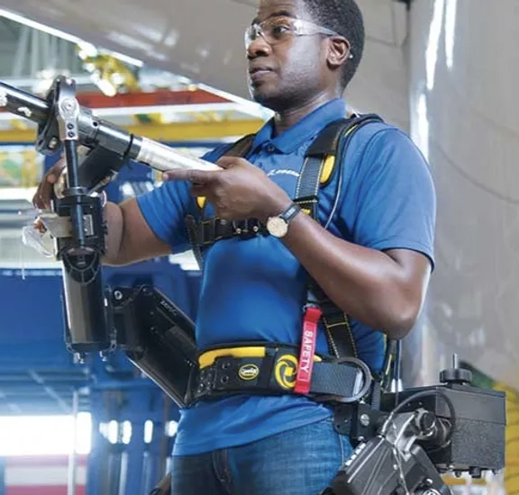 Man holding a metal rod in the workplace