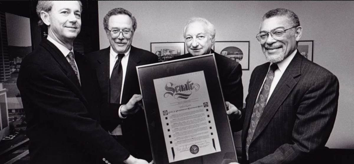 Men holding an Assembly certificate 