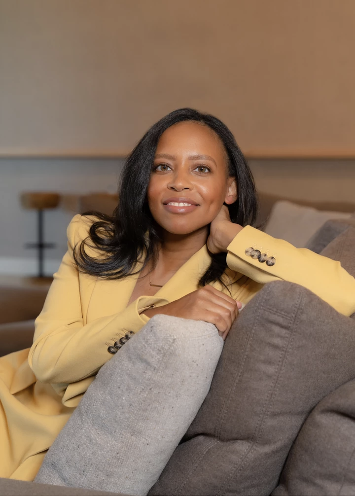 Image of Dr. Sarah Johnson sitting on couch 