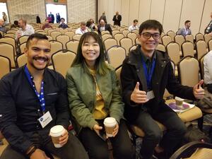 3 Students sitting at the HFES 2019 conference
